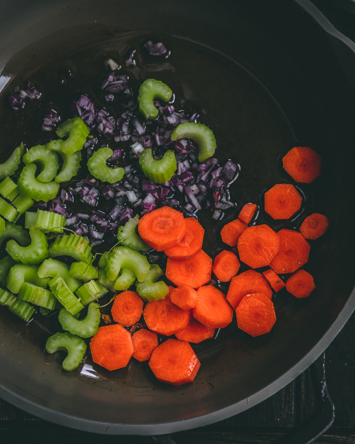 vegetables added to a pan 