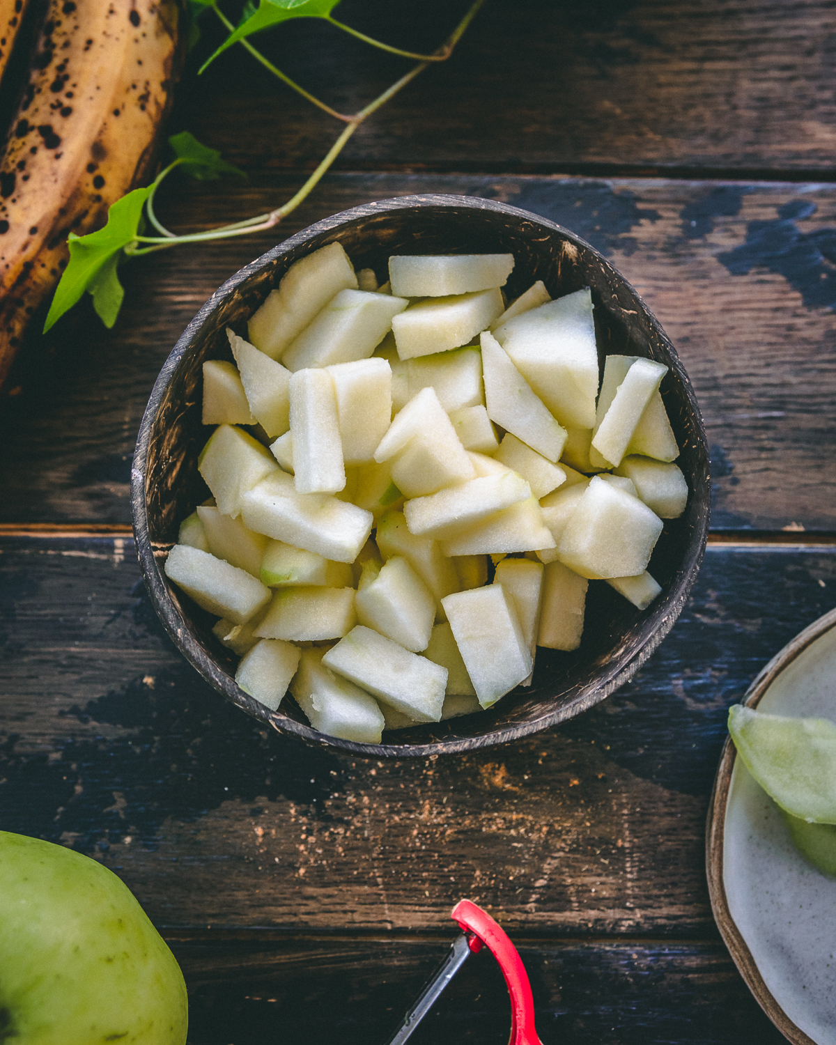 a bowl of cut apples 