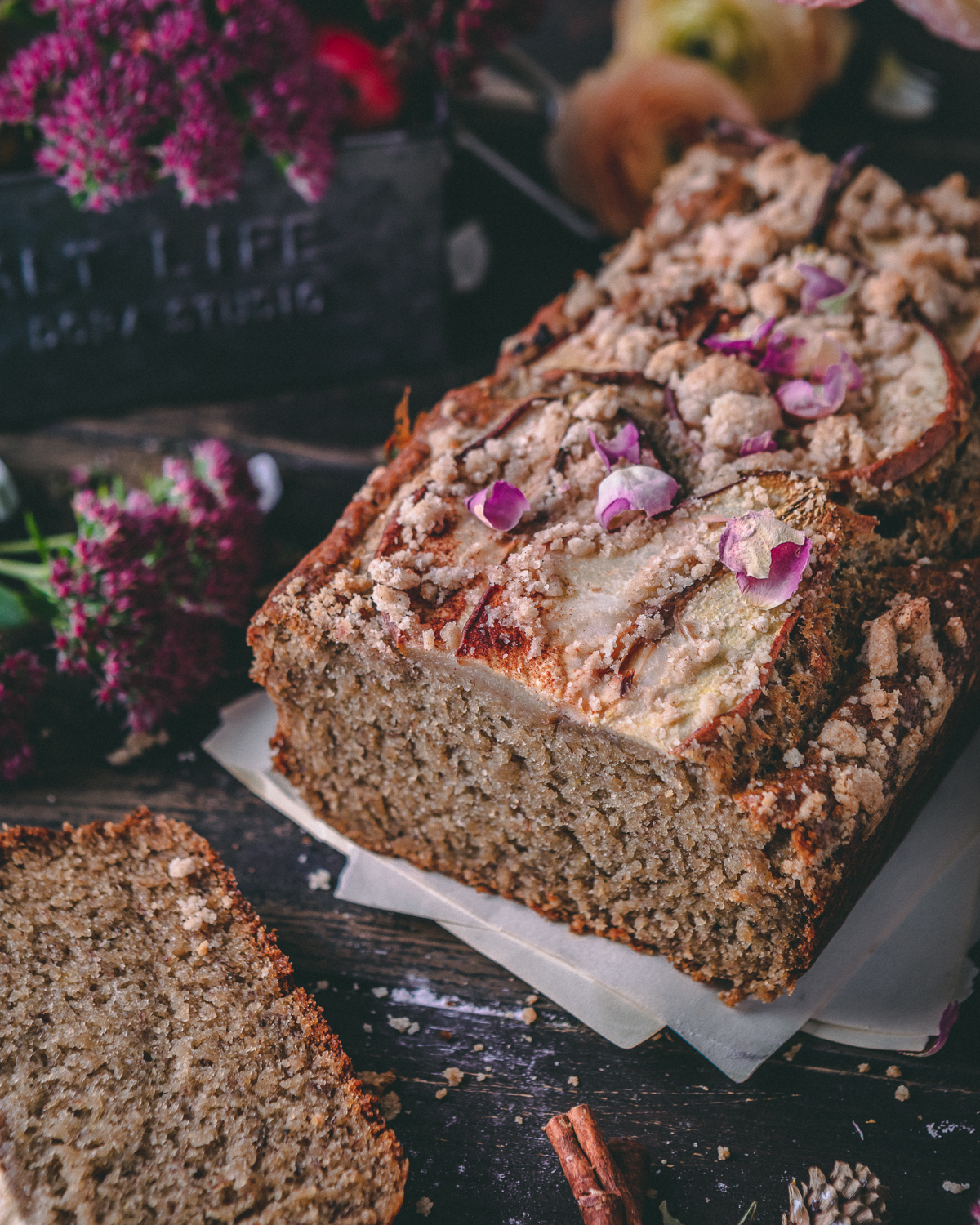 Pear banana loaf garnished with rose petals 