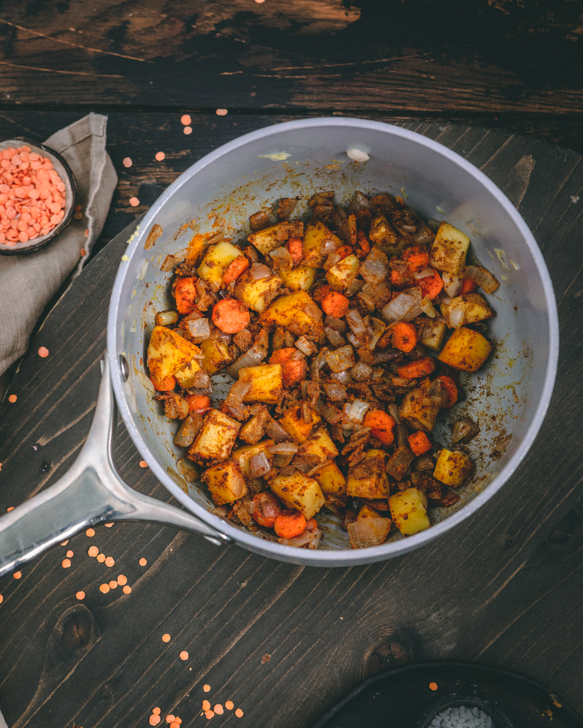 Simmering vegetables in pan